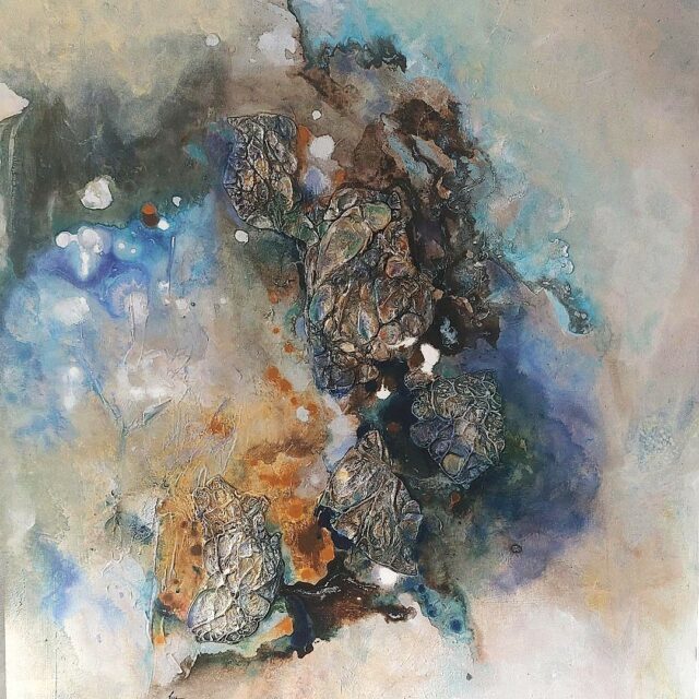 Original mixed media abstract painting by Anna Darasma depicting a cosmic nebula with dark, textured mineral shapes floating in a luminous field of blue, white, and earthy gold.